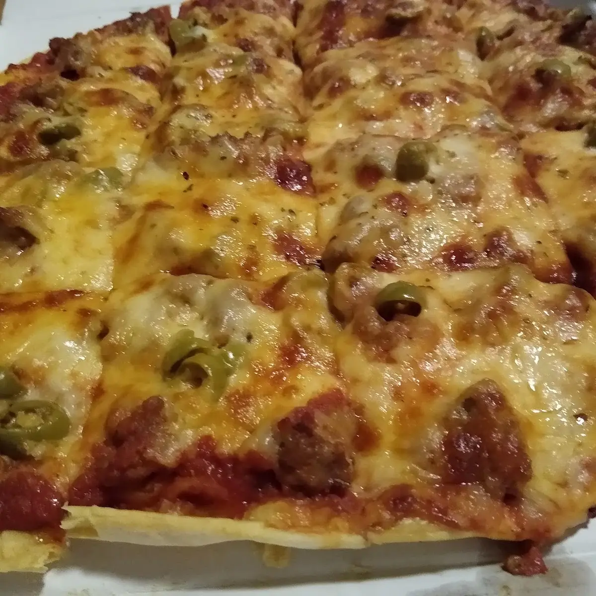 Sausage and Green Olives on Extra Thin Crust Pizza