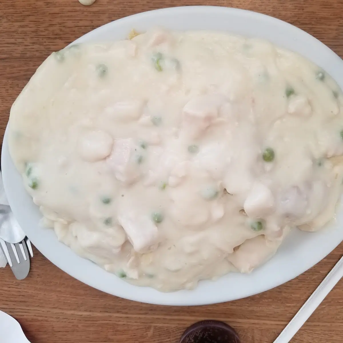 Creamed Chicken with Peas over Biscuits