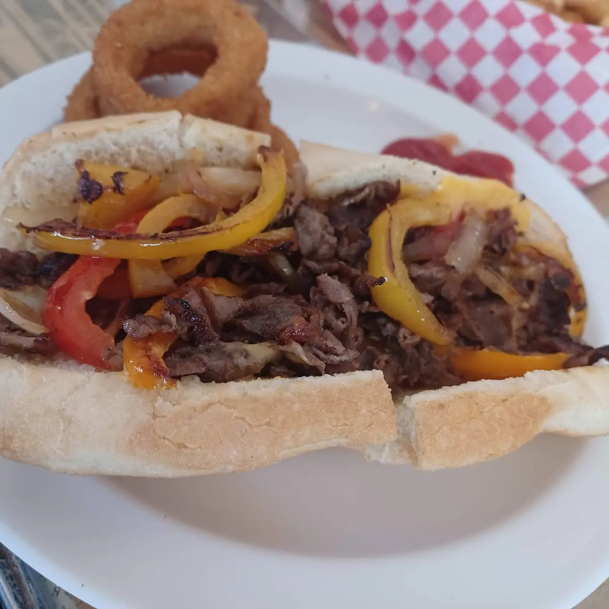 Steak and Cheese Sub with Onion Rings