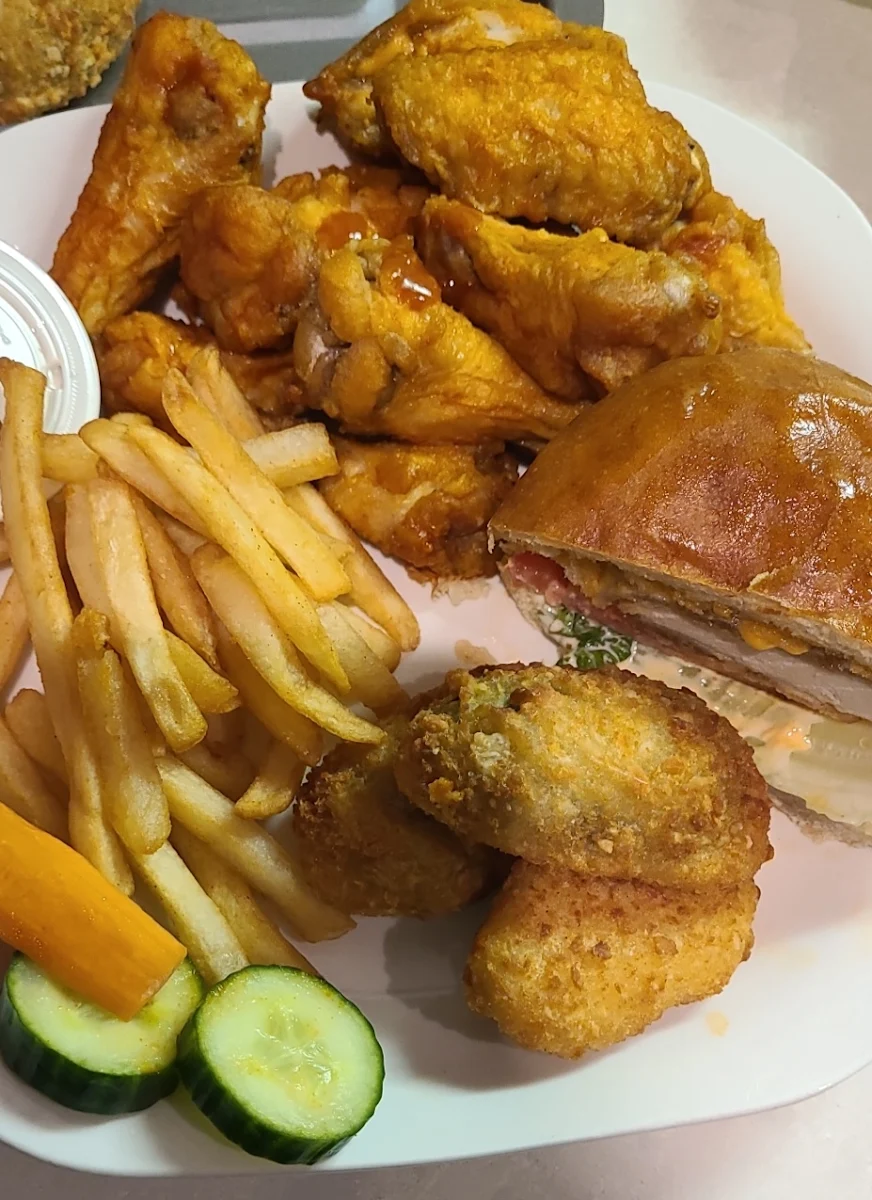 A Christmas Eve Combo Paneer Burger Wings Chicken Sandwish Jalapeños Poppers Couldn't Pick Just One