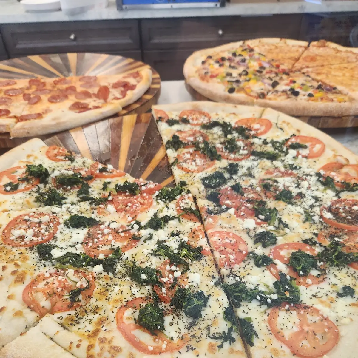 Pizza by the Sliced Tomatoes