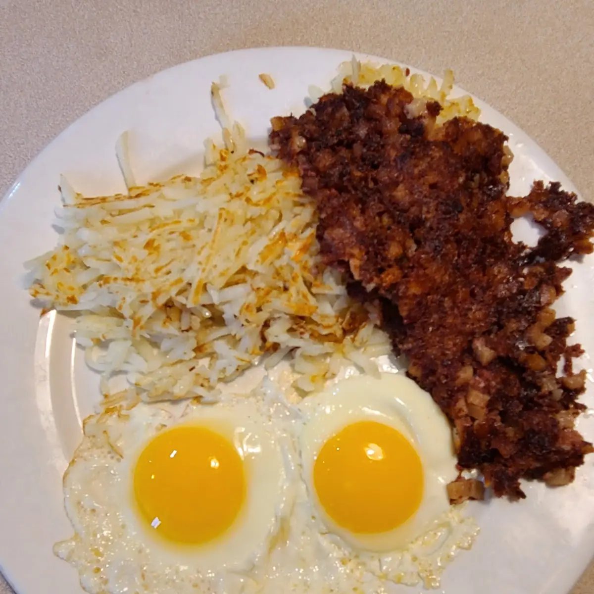 Two Eggs Sunny-Side Up with Cornbeef and Home Fries