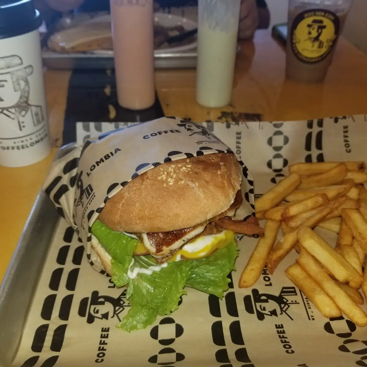 Jucy Burger and Fries with a Hot Chocolate Drink