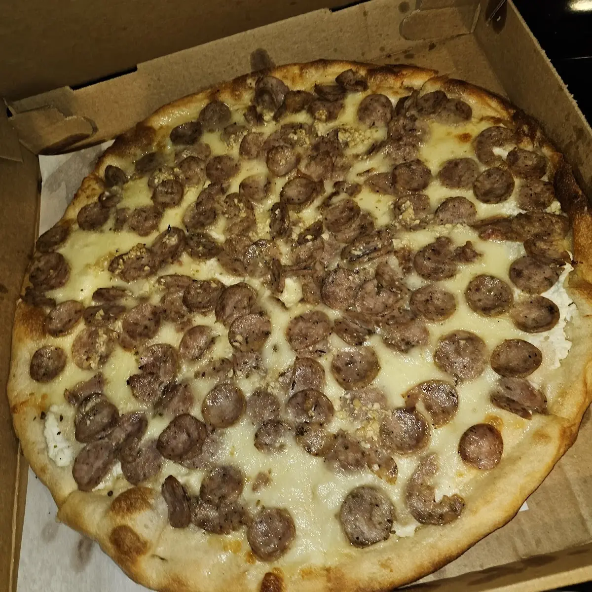 White Pizza with Garlic and Extra Extra Sausage Pizza
