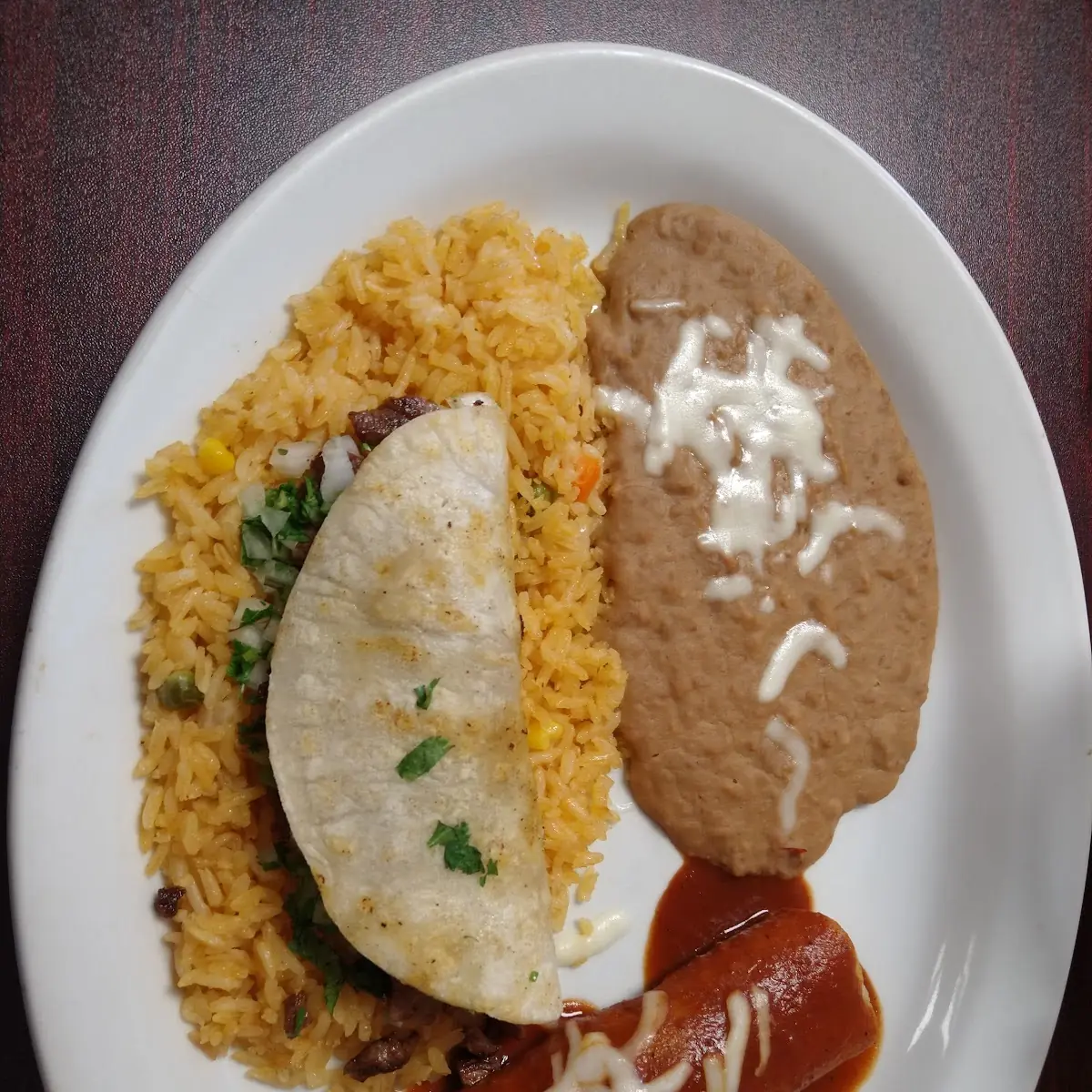 Two Beef Tacos Mexican Rice and Refried Beans