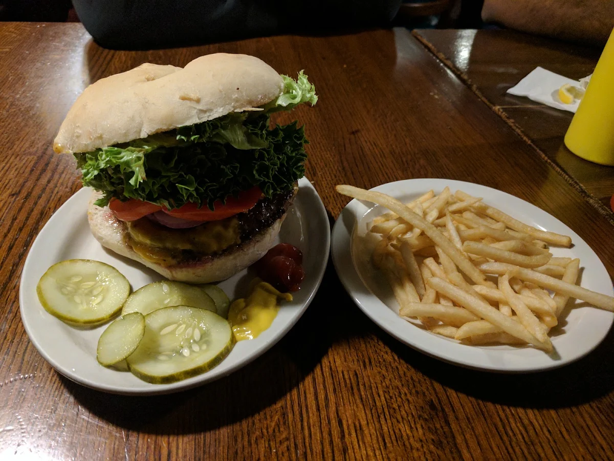The Black Bean Burger with Pepper Jack Avocado Tomatoes and Baby Spinach Pickles on the Side
