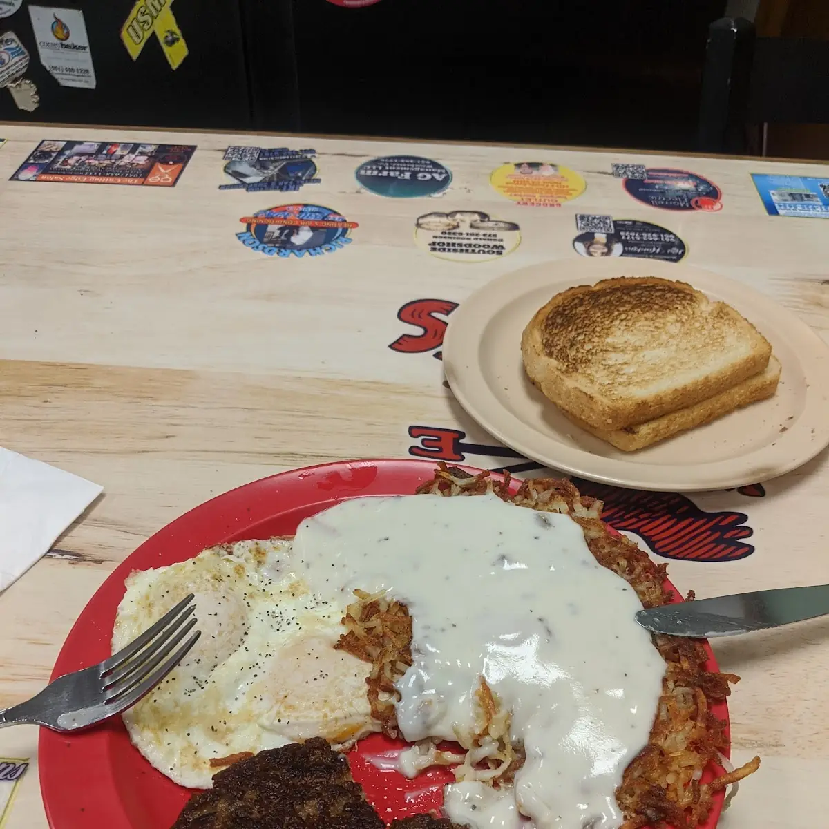 Two Eggs over Medium Has Browns with Sausage Gravy