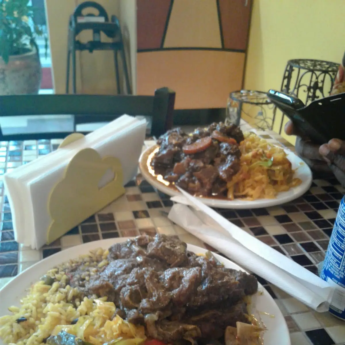 Curry Goat Rice and Peas and Fried Cabbage