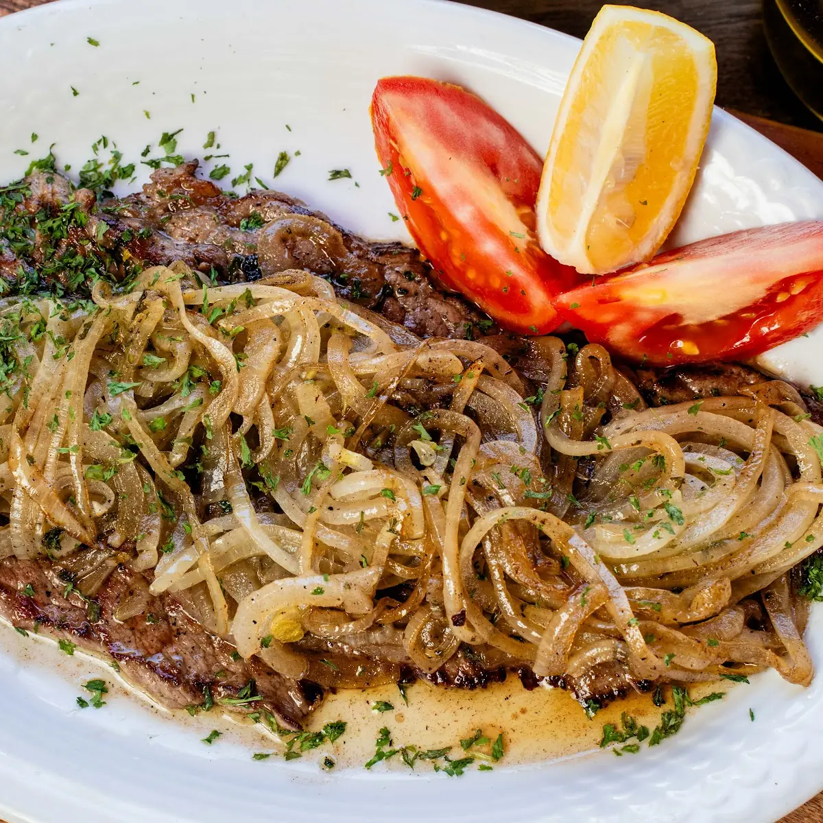 Steak with Grilled Onions on Top with Two Side Order