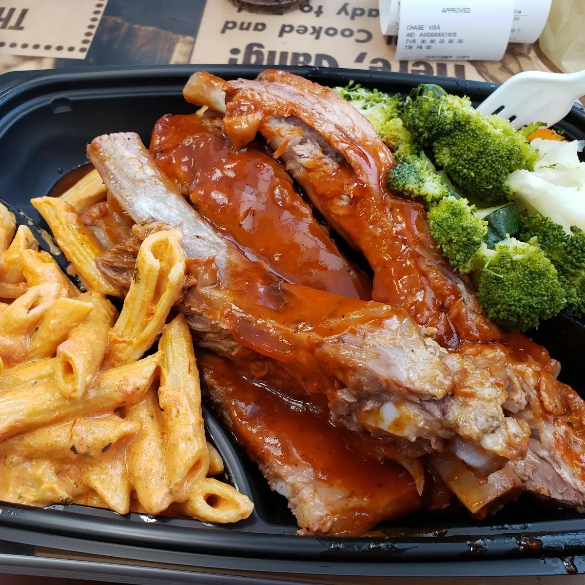 Rib Dinner with Penne Pasta and Steamed Broccoli
