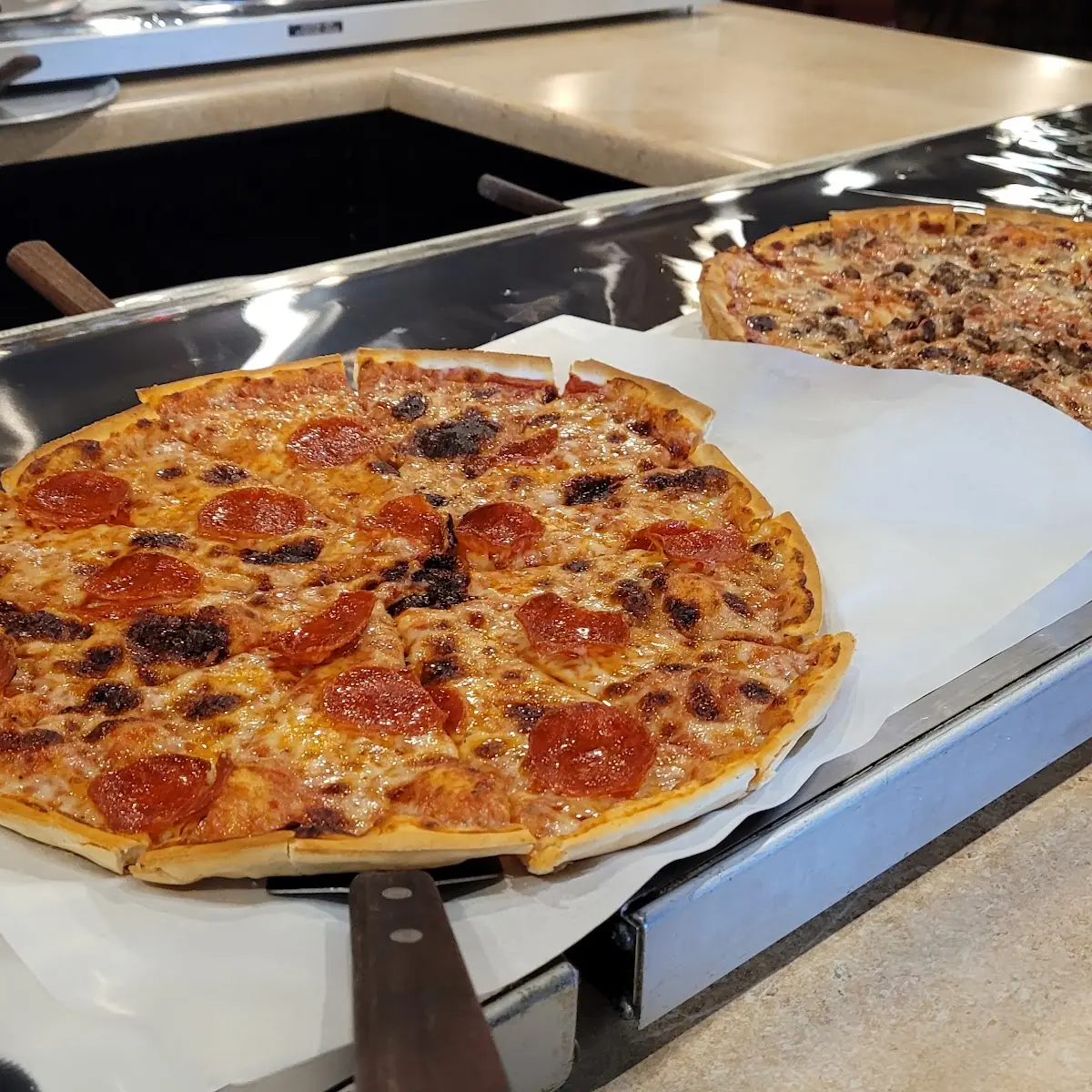 Supreme Pizza and Pepperoni Pizza