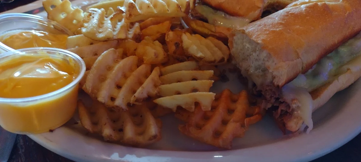 Philly Cheesesteak & Waffle Fries with Cheese