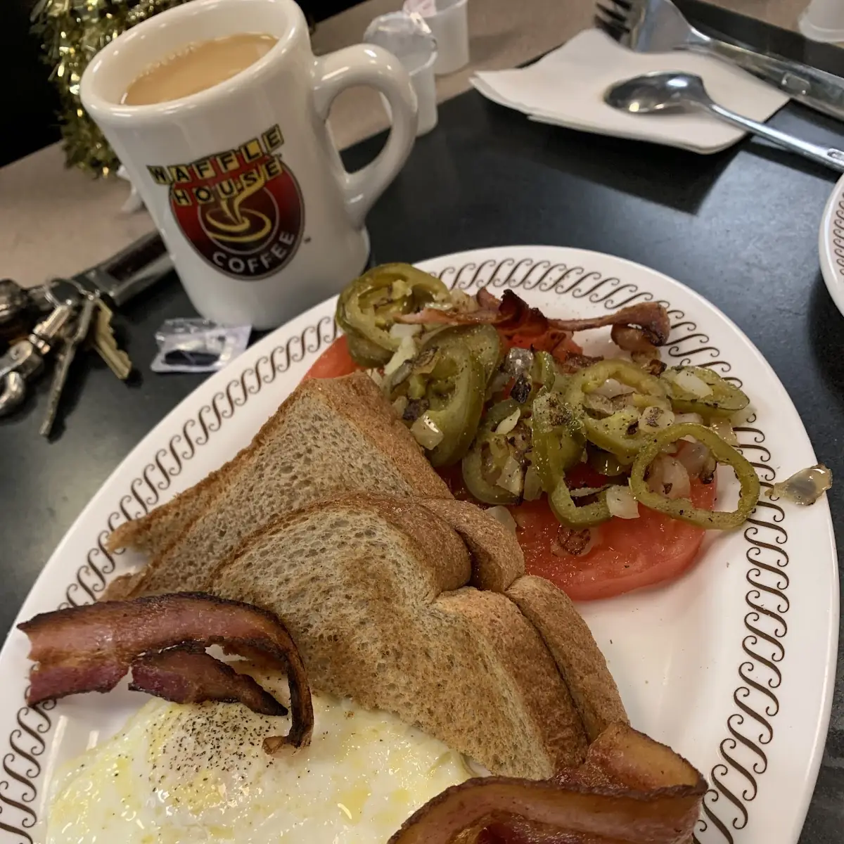 2 Eggs Any Style with Crispy Bacon Wheat Toast Tomatoes Jalapeños