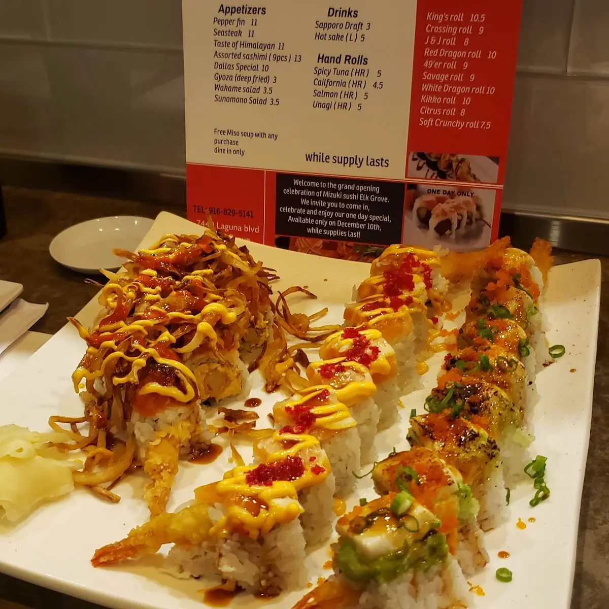 White Dragon on the Right Citrus Roll Middle Keko Left