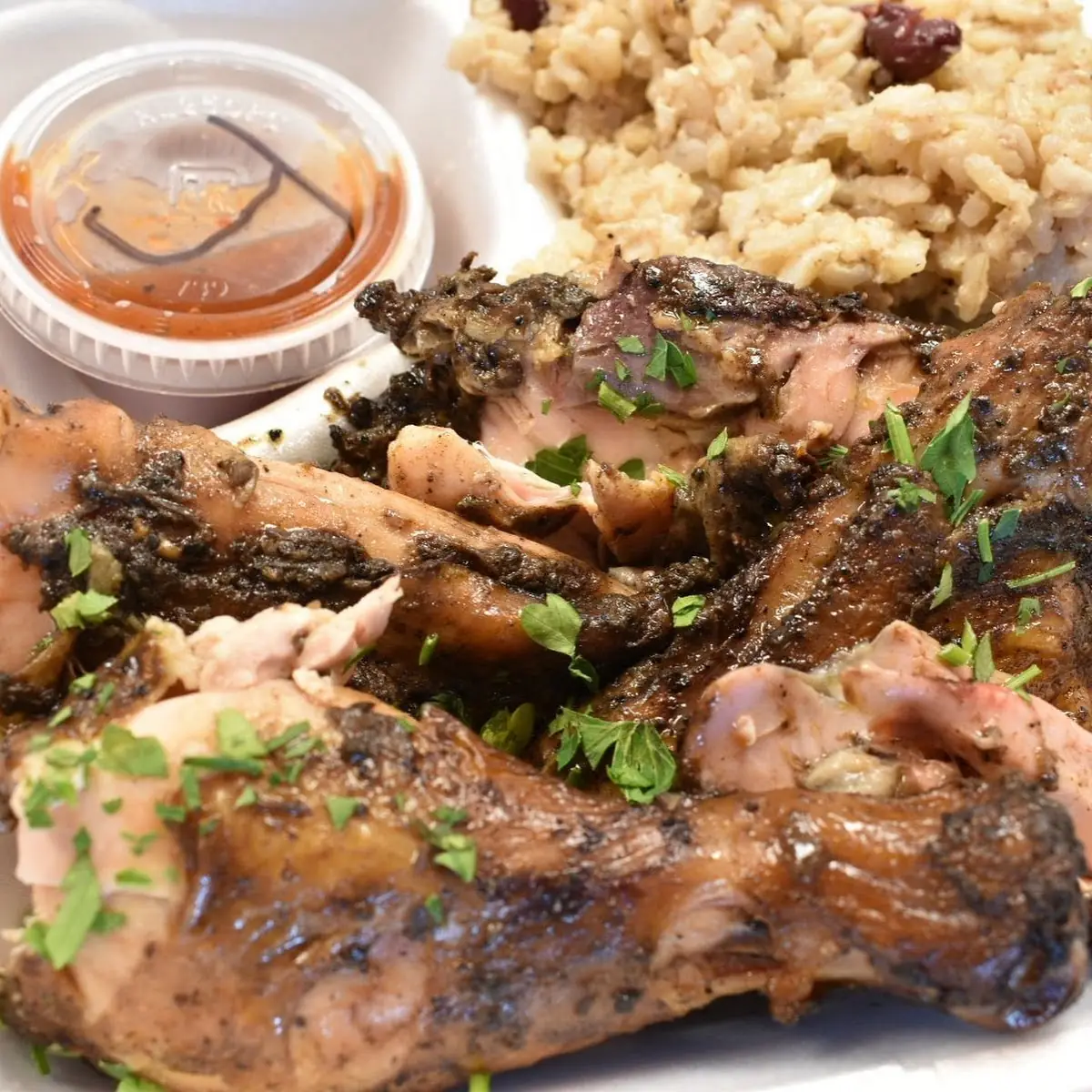 Jerk Chicken Served on Rice & Peas