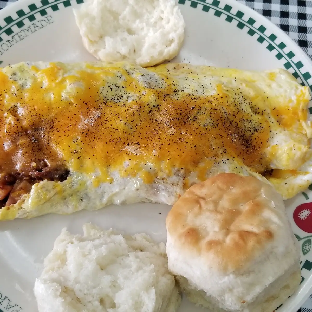 Bacon Sausage and Cheese Omelet with a Biscuit