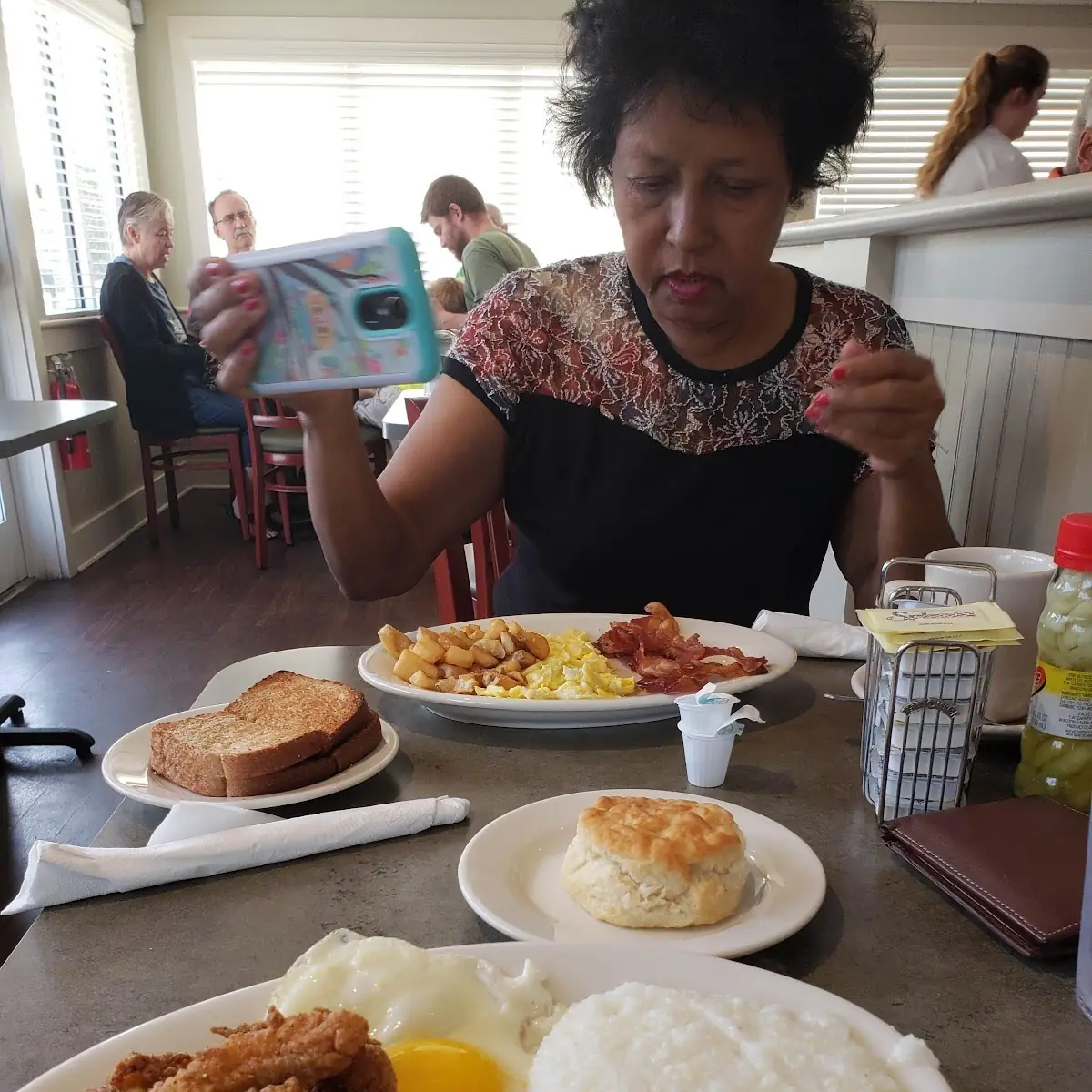 Salmon Patty Scrambled Eggs Grits and Liver Pudding