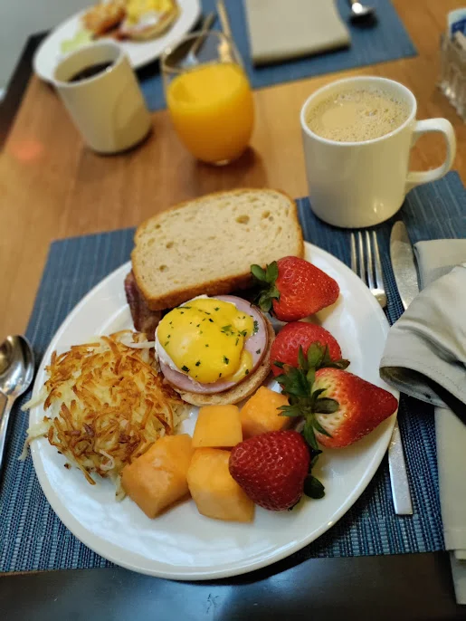 Hash Browns Eggs Benedict Fresh Fruit Wheat Toast Breakfast Buffet
