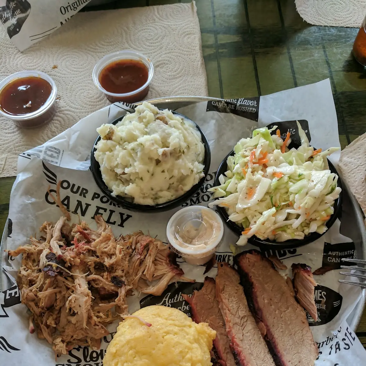 Pulled Pork Lean Brisket Vinegar Coleslaw Mashed Potatoes and a Corn Muffin