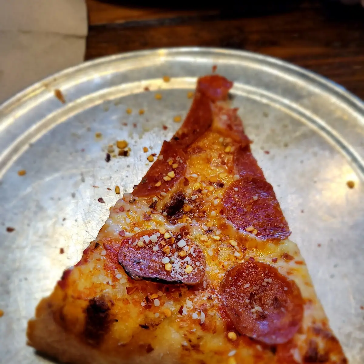 Pepperoni Pizza Slice with Red Pepper Flakes