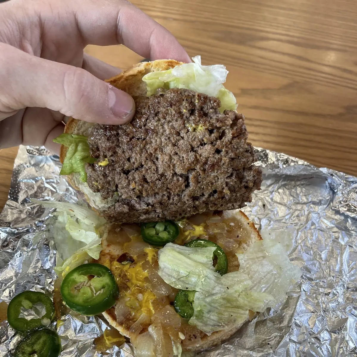 Single Stack Burger Eith Jalapeños Lettuce Onions Banana Peppers Spicy Mustard
