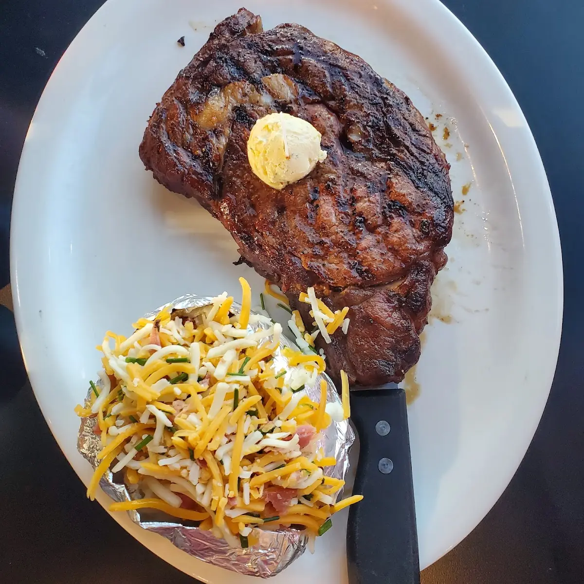 Ribeye and Loaded Baked Potatoe
