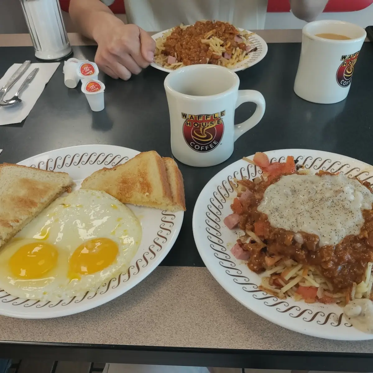 Hash Browns with Everything White Toast Two Eggs Sunny Side Up & Bacon