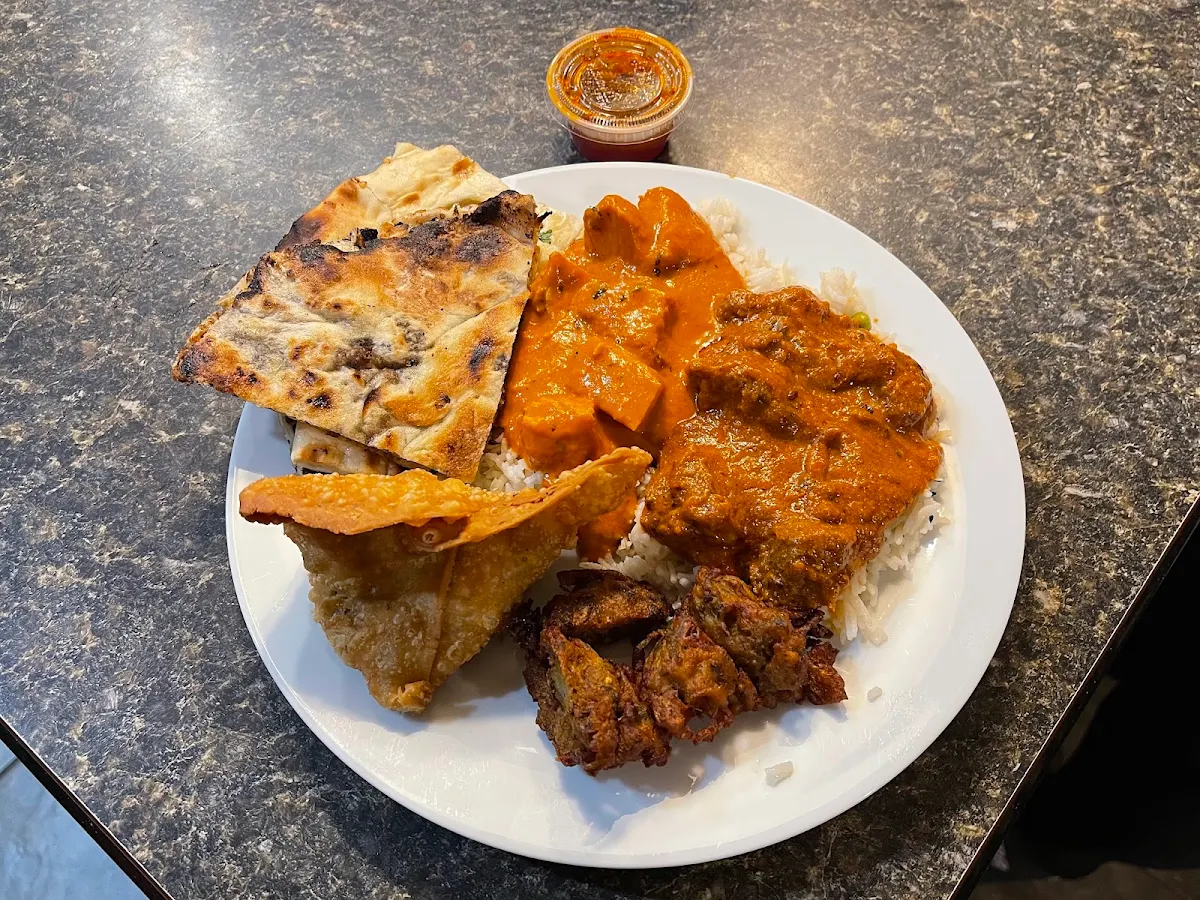 Lamb Rogan Josh Butter Chicken and Coconut Rice Vegetable Pakora Vegetable Samosa and Naan Bread, Shandhar Hut Indian Cuisine - Downtown