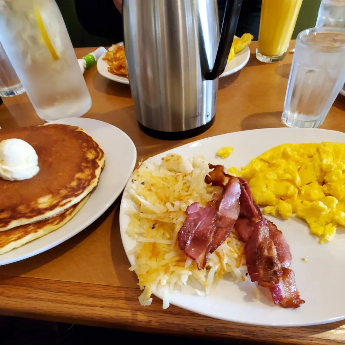 2 Eggs Poached Hash Brown Potatoes Bacon Pancakes & Brewed Coffee