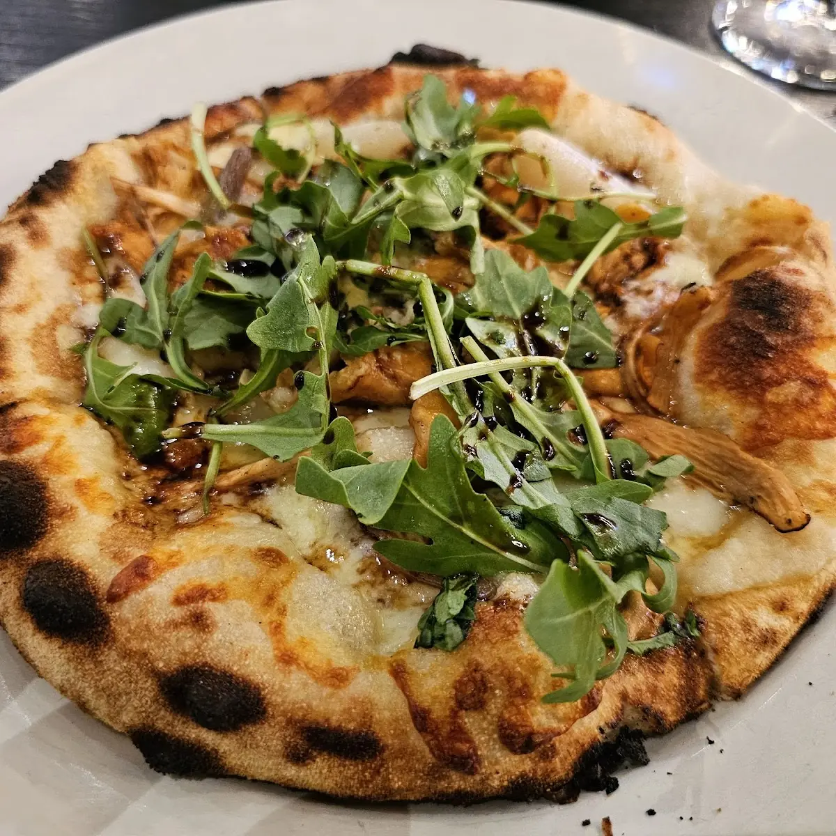 Garlic Chicken Pizza with Arugula Salad Pizza