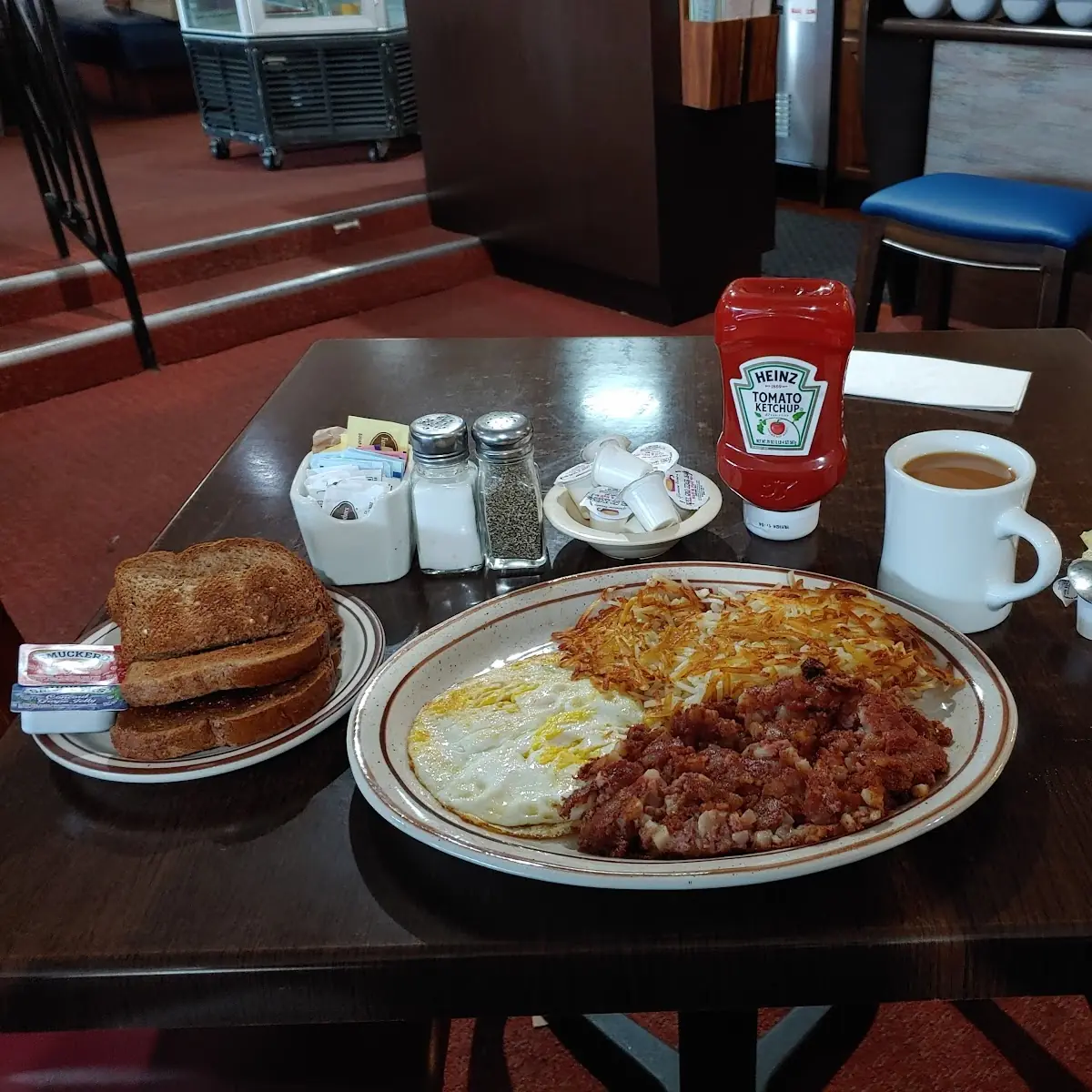 Corned Beef Hash Eggs over Hard Hash Brown's Wheat Toast Coffee