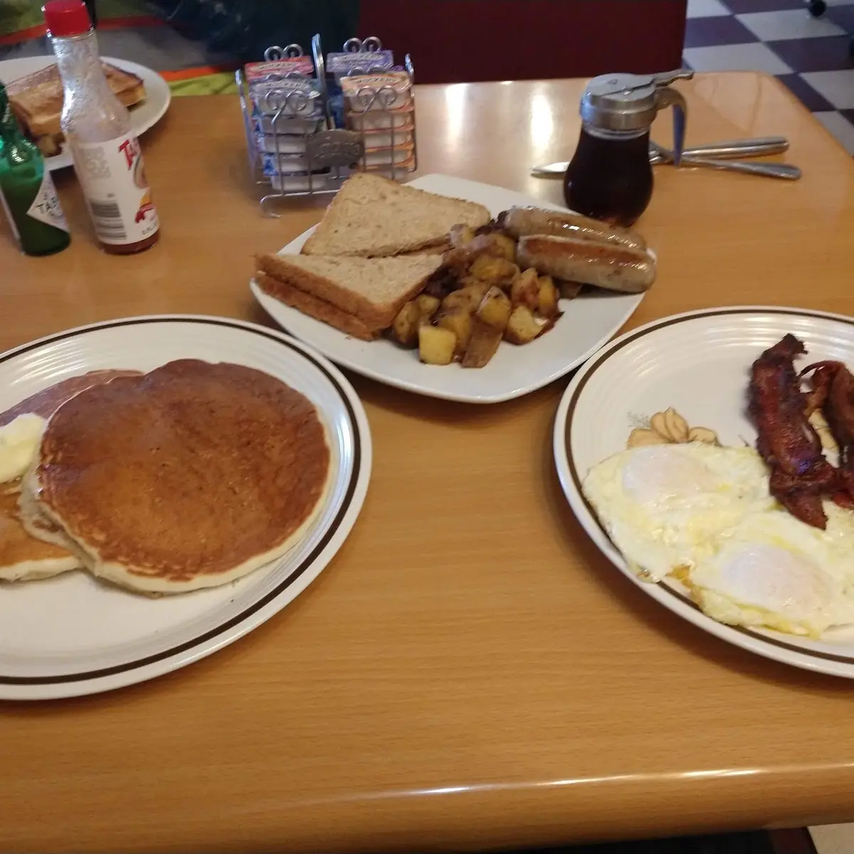 Pancakes Eggs Bacon Sausage and Toast