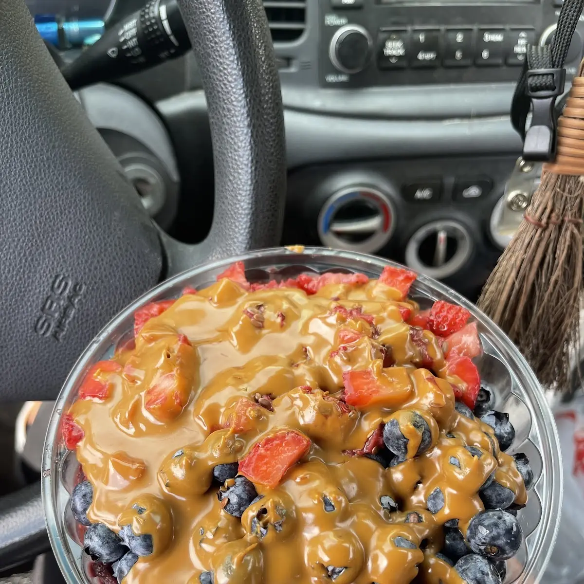Acai Bowl Base with Strawberries and Blueberries with Cookie Butter Swirls Under Fruit and on Top