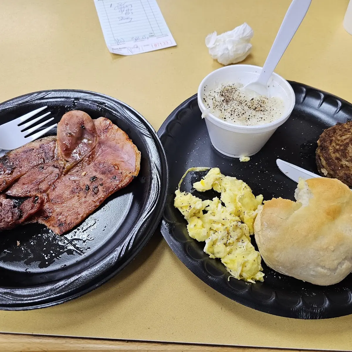 Country Ham Scrambled Eggs Grits Sausage Patties and a Biscuit