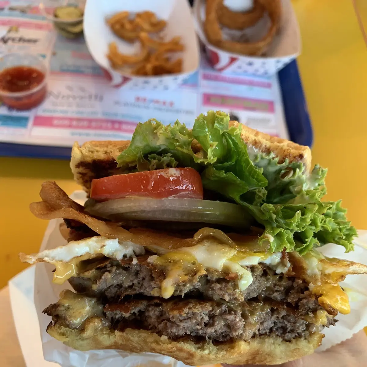 Double Bacon Cheeseburger with Fried Egg and Raw Onion