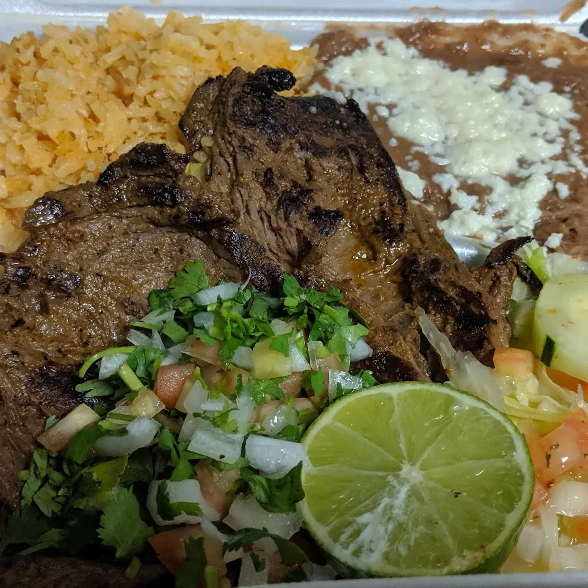 Asada Pollo and Carnitas Taco Platter w Rice & Beans