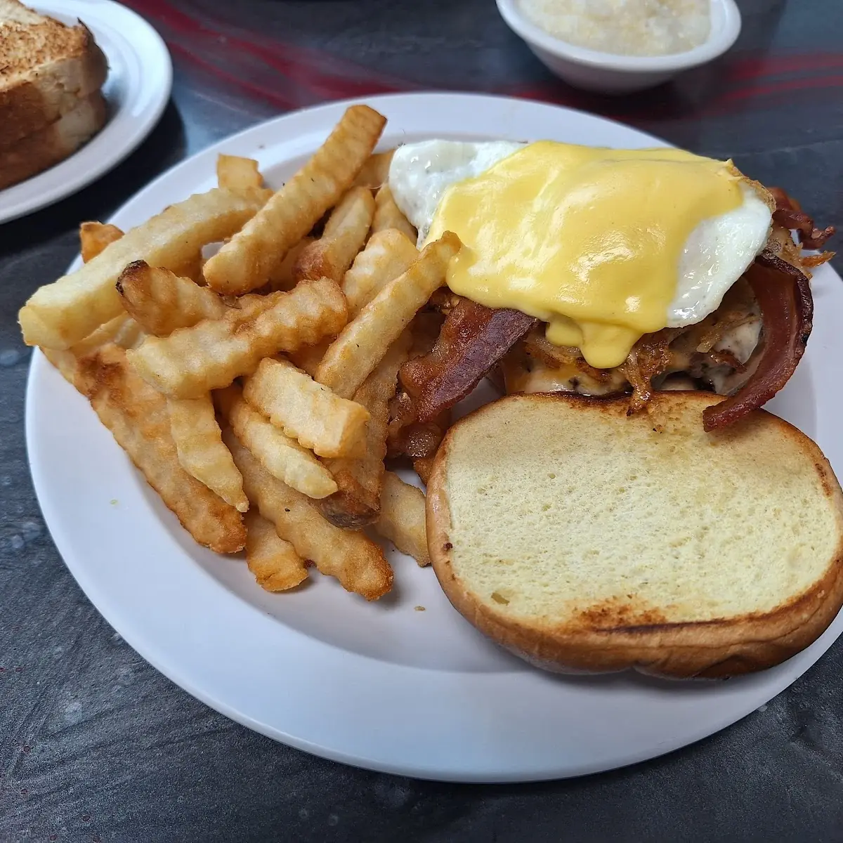 One Scrambled Egg (Choice of Toast, Add Cheese for an Extra Charge)