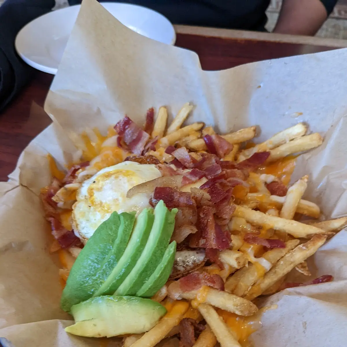 Fries with Cheese Egg and Avocado Slices
