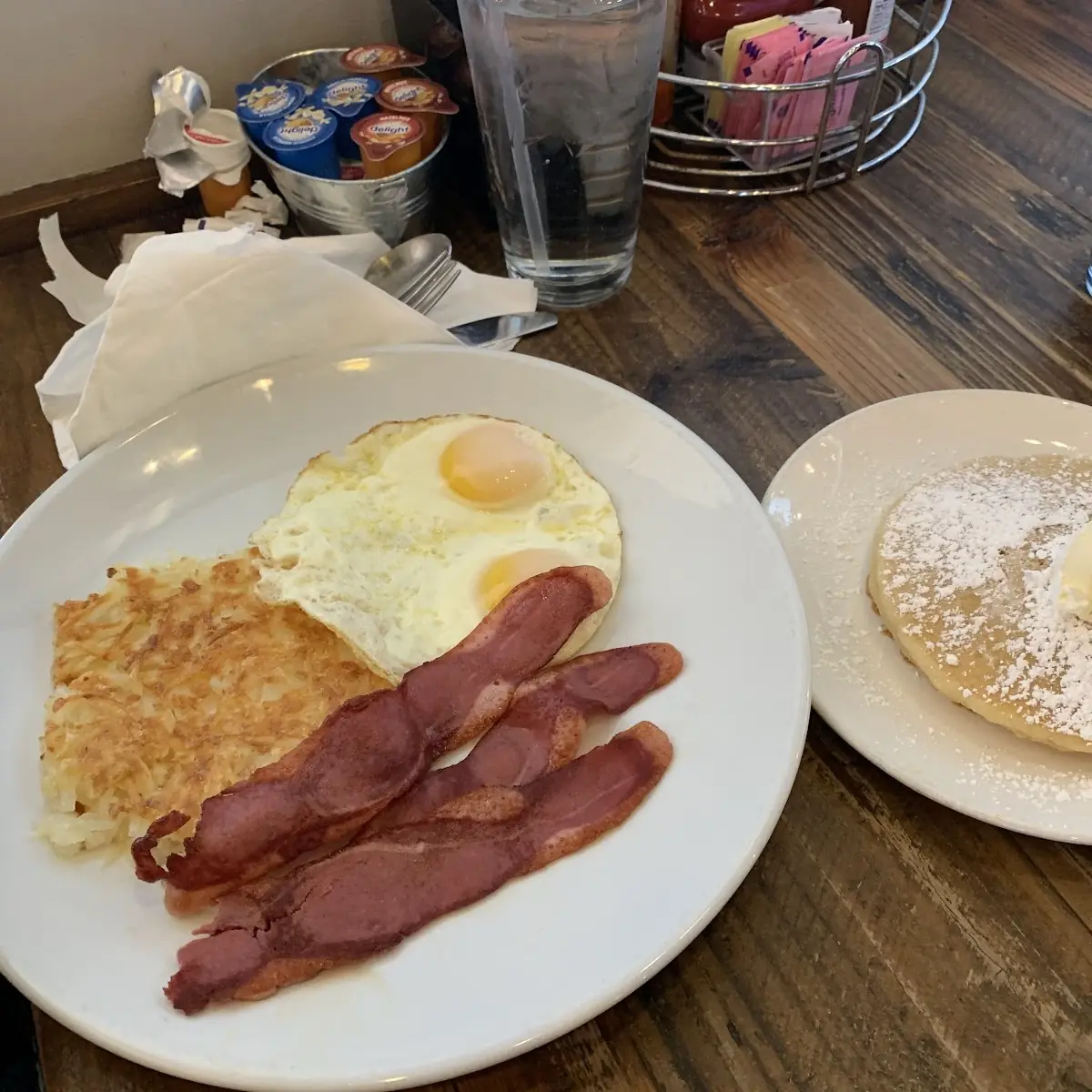 Two Eggs Any Style with Pancakes Hashbrowns Turkey Bacon