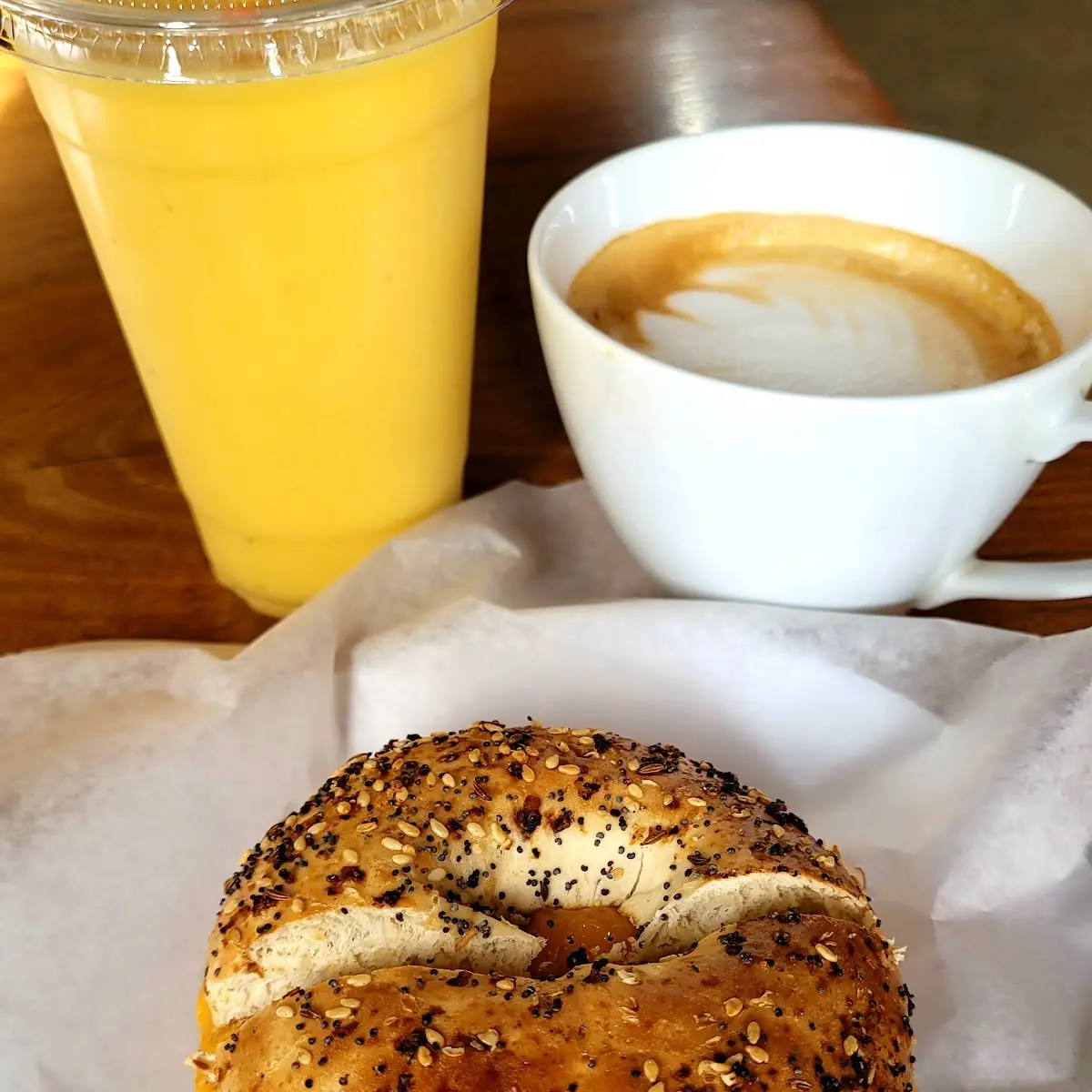 Ham & Cheese on Everything Bagel Pineapple & Mango Smoothie and a Cortado