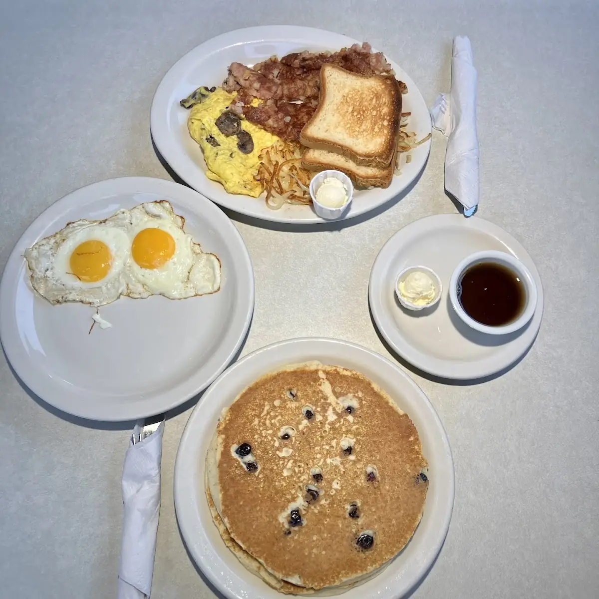 Blueberry Pancakes with Eggs and Hashbrowns