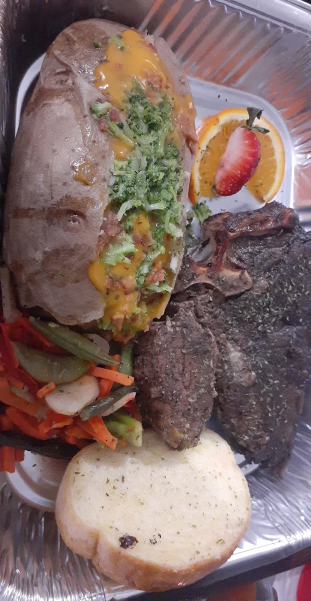 T-Bone Steak Baked Potato Veggies and Garlic Bread