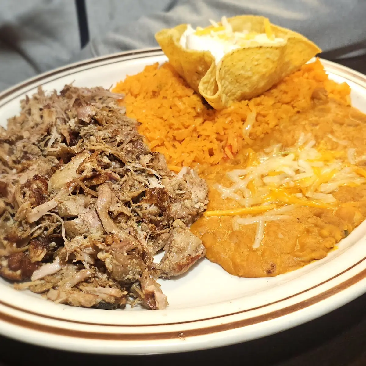Pork Carnitas with Refried Beans and Rice