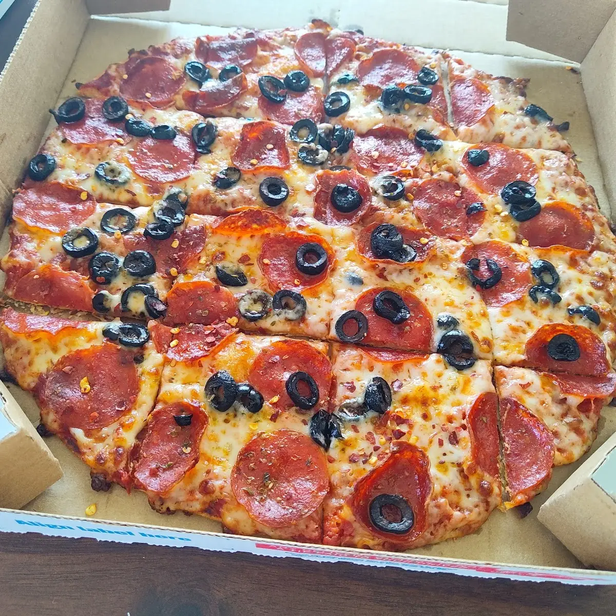 Thin Crust Pepperoni and Olive Pizza