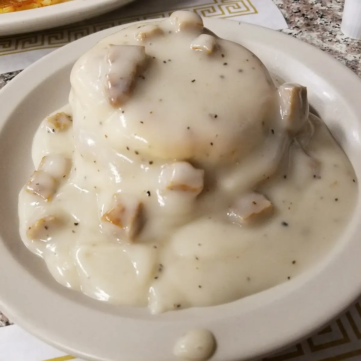 Famous Sausage Gravy over Biscuit