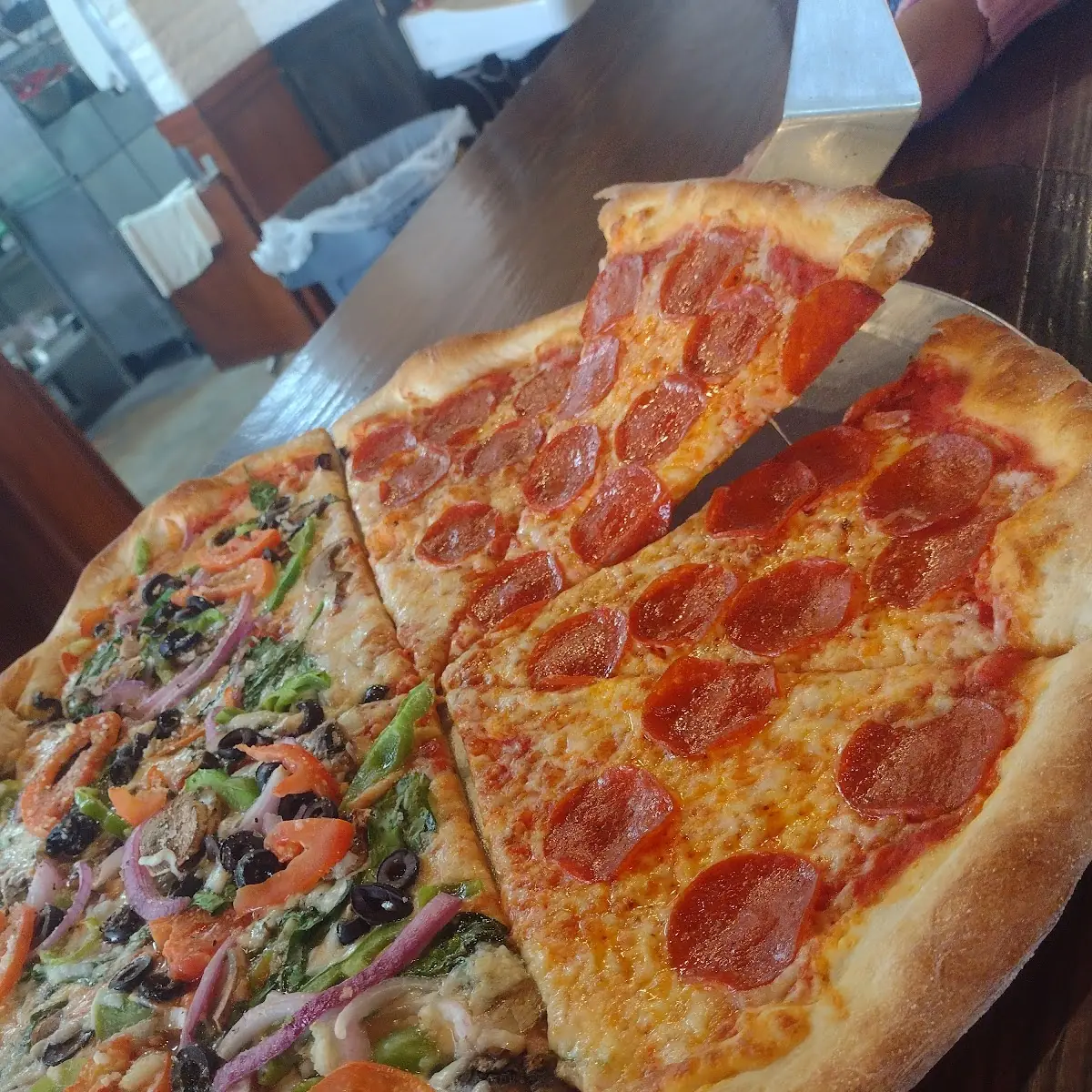 Half Veggie and Half Pepperoni Pizza