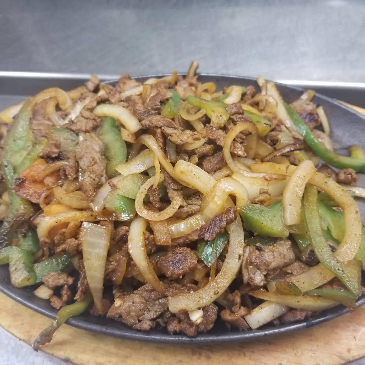 Steak Chicken & Shrimp Fajitas