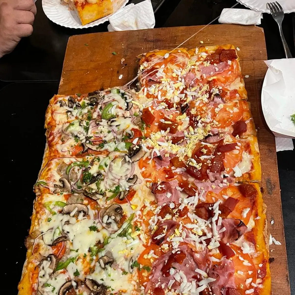 Supreme Pizza on the Left Side and Ham and Cheese on Other