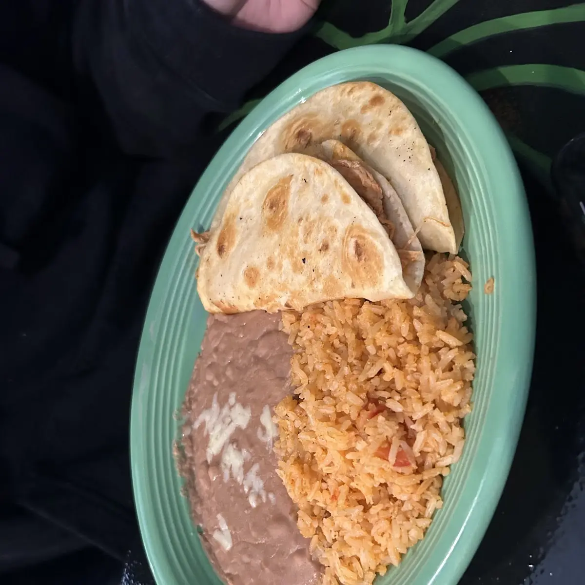 V4. One bean tostada, one cheese enchilada and Mexican rice.