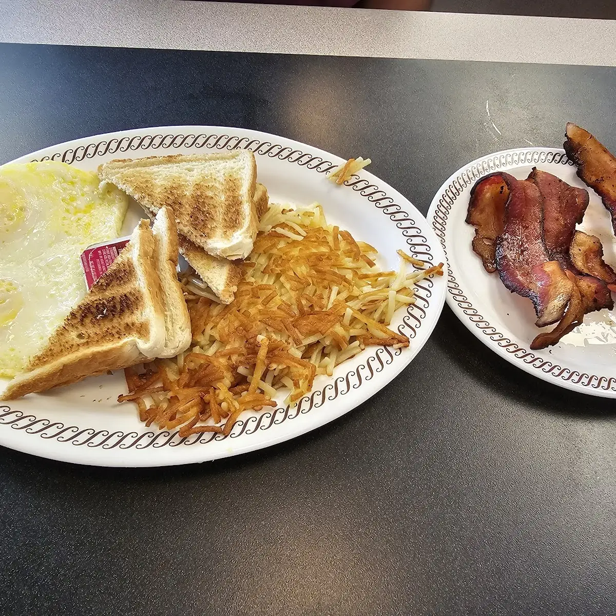 Eggs Toast Hashbrowns and Crispy Bacon